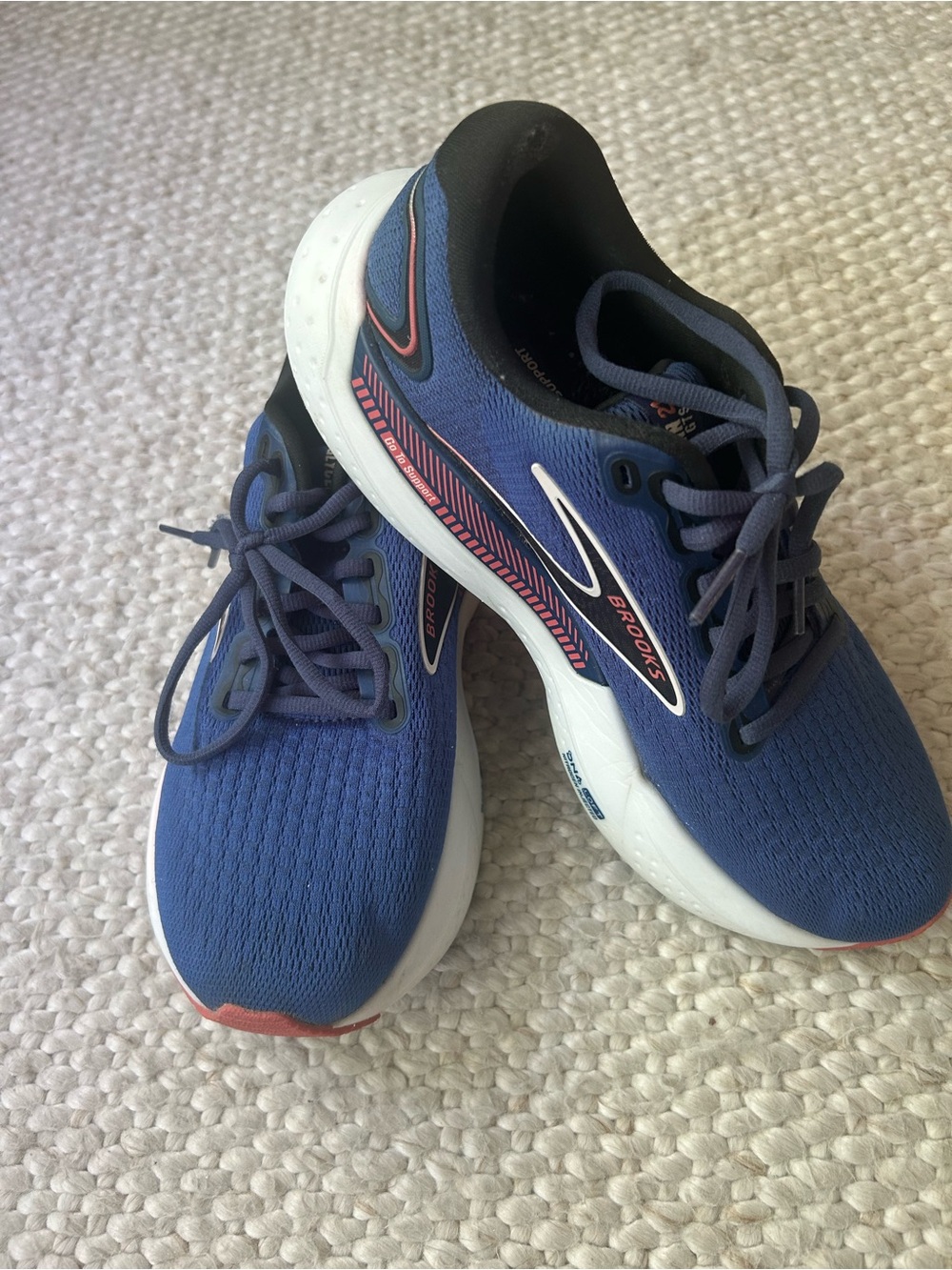 Brooks Navy Blue Running Sneakers with White Soles and Pink Accents